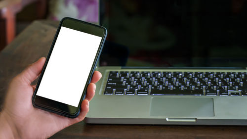 Close-up of mobile phone on table