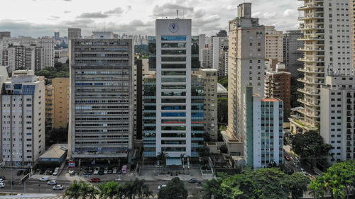 Buildings in city against sky