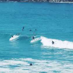 Tourists doing water surfing