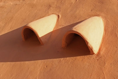 High angle view of hole on sand