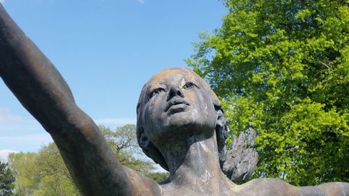 Low angle view of statue against sky