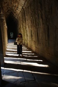 Woman standing on staircase