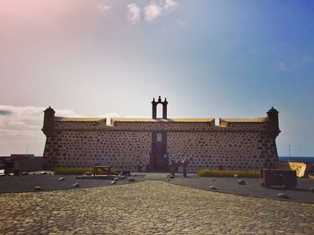 Building against cloudy sky