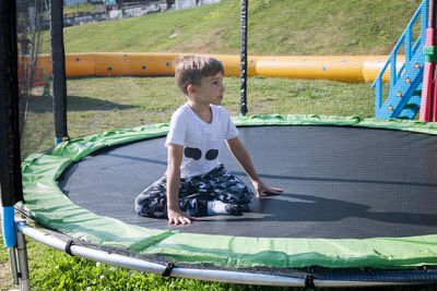 Boy playing on trampoline