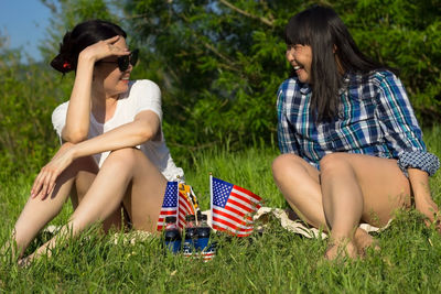 Women with usa flags, patriotic american national holiday 4th of july independence day