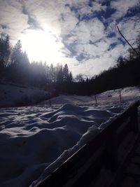 Scenic view of landscape against sky during winter