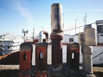 Close-up of abandoned factory against sky