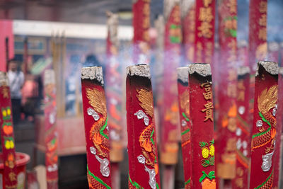 Close-up of multi colored candles in market