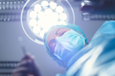 Directly below shot of surgeon operating in studio