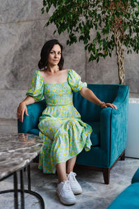 Young woman sitting on chair