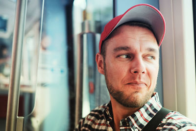 Portrait of young man wearing hat