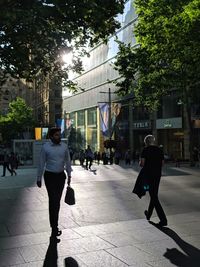 People walking on street in city