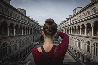 Woman standing against wall