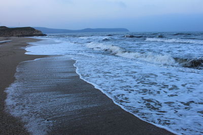 Scenic view of beach against sky