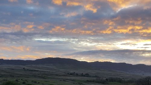 Scenic view of landscape against sky during sunset