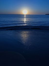 Scenic view of sea against clear sky during sunset