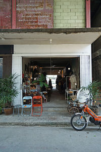 Bicycles on sidewalk by building in city