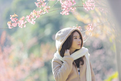 Portrait of young woman looking away