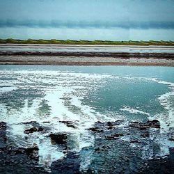 Reflection of clouds in sea