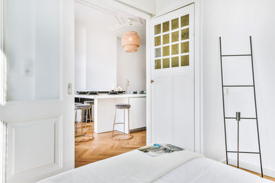 View of kitchen seen through bedroom