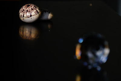 Close-up of lamp against black background