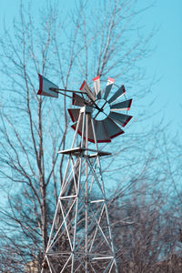 Traditional windmill against bare trees