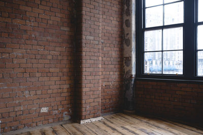 Brick wall by window at home