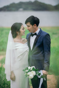 Young couple standing outdoors