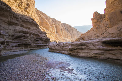 Scenic view of rocks and mountains against sky