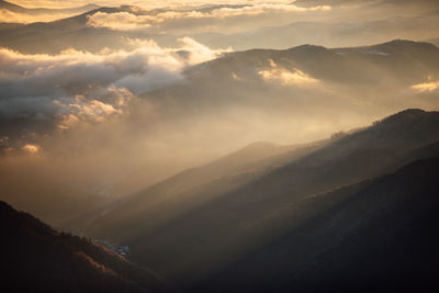 Scenic view of mountains against sky during sunset