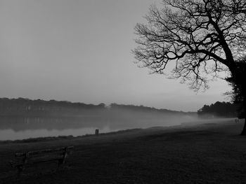 Scenic view of lake against sky during foggy weather