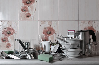 Close-up of utensils in sink at kitchen