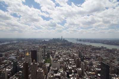 High angle view of city buildings against sky