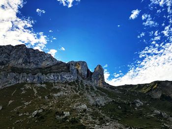 Low angle view of rock formations against sky