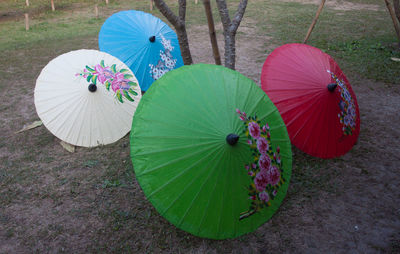 High angle view of multi colored umbrella on land