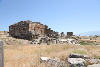 View of old ruins against clear blue sky