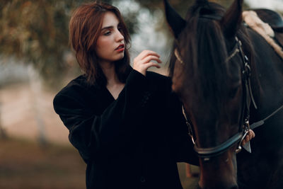 Side view of young woman looking away