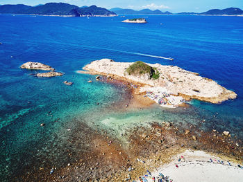 High angle view of rocks on sea shore