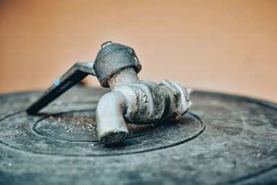 Close-up of tap on plastic container