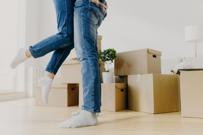 Carefree playful couple in new apartment