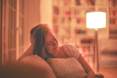 Portrait of woman lying down at home