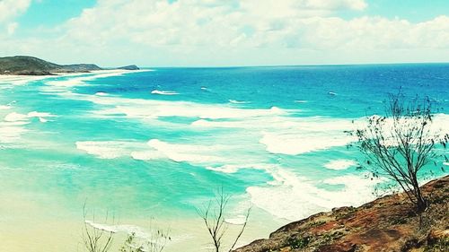 Scenic view of sea against cloudy sky