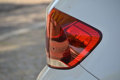 Close-up of red wine glass in car