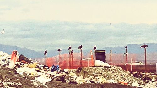 View of rocks against cloudy sky