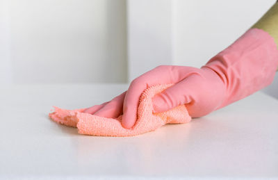 Cropped hand of woman with heart shape on table