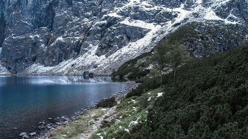 Czarny staw pod rysamy or black pond lake near the morskie oko snowy mountain hut in polish tatry