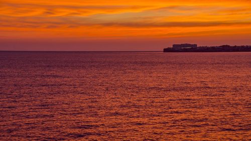 Scenic view of sea at sunset