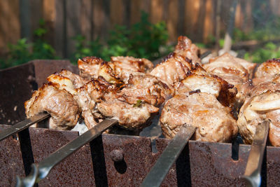 Close-up of meat on barbecue grill