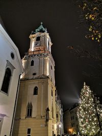 Low angle view of illuminated buildings at night