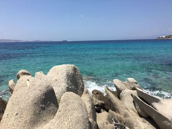 Scenic view of sea against clear blue sky